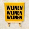 Tegel met tekst geel